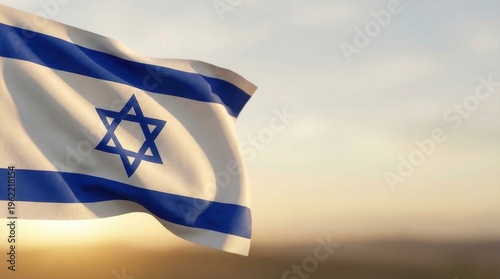 National flag of Israel waving in the wind against a blurred sunset sky background