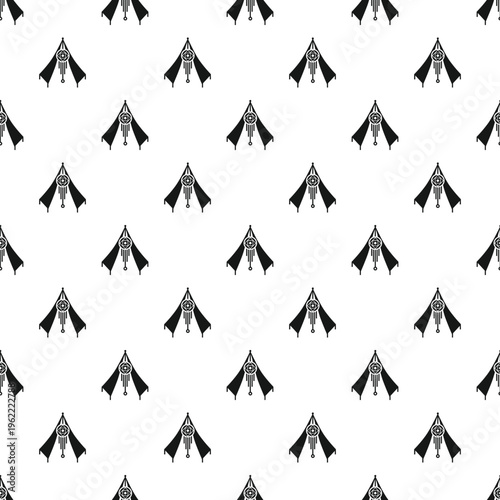 Seamless pattern of indigenous tribal teepee tents with dreamcatcher elements