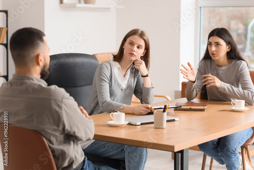Fotografie Family mediator working with couple at table in office