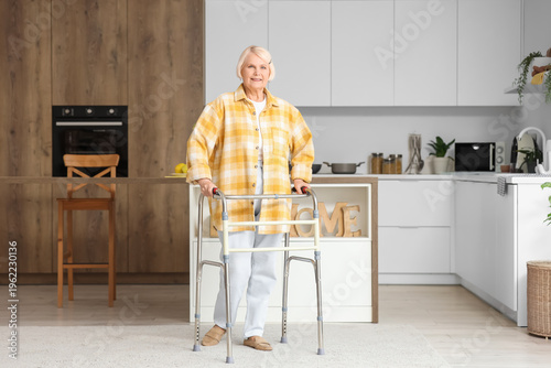 Senior woman with walker in...