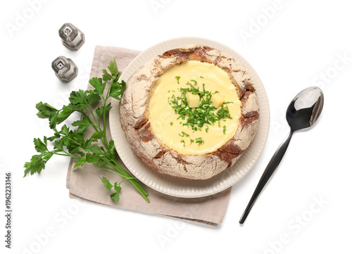 Cheese soup in bread bowl w...