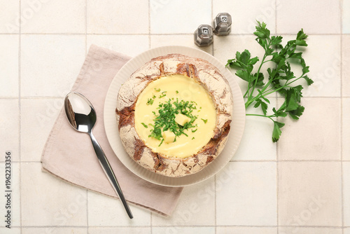 Cheese soup in bread bowl w...