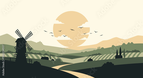 Windmill in a rural landscape at sunset.