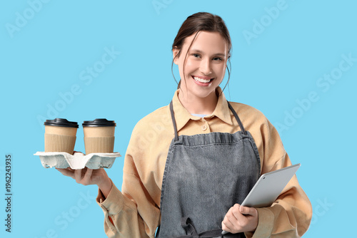 Happy young female barista ...