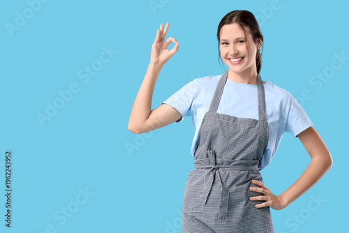Happy young female barista ...