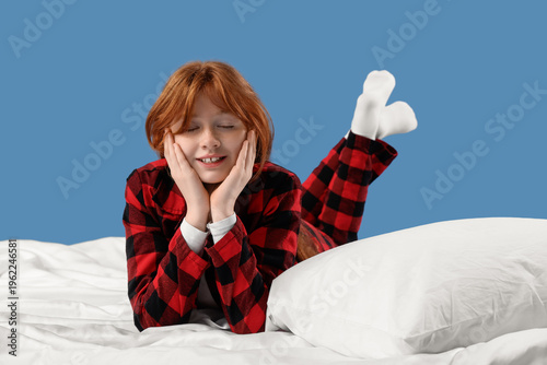 Sleepy girl in pajamas with...