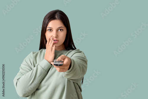 Shocked young woman with re...