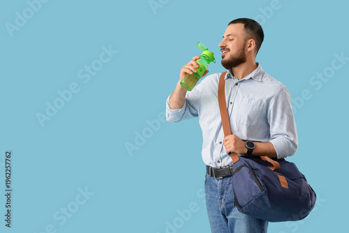 Young man with sports bag d...