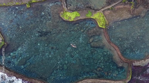 Aerial Panoramic View Woman Swimming Volcanic Rock Pool Sunrise El Hierro Canary Islands Spain Natural Pool Solitude