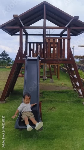 A little boy is playing in the park