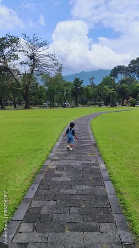 A little boy is playing in the park