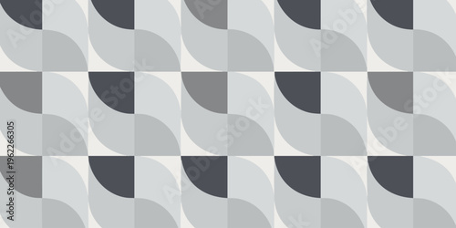 A geometric pattern of gray and black shapes fills the top half of the frame.