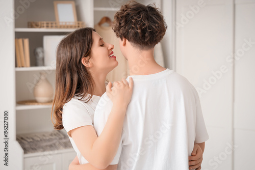 Happy young couple hugging ...