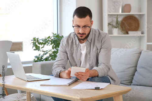 Young man with refund form ...