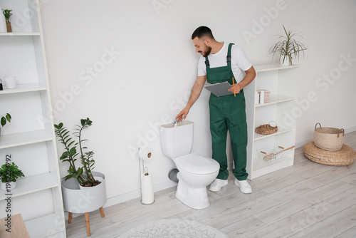 Male plumber with clipboard...