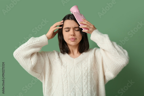 Young woman warming her hea...