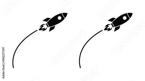 Two rockets launching upwards with curved trails a striking black silhouette