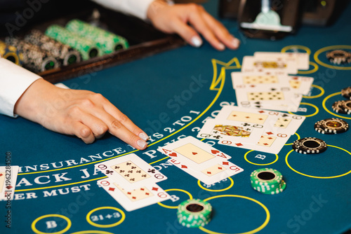 Fotografía Blackjack Table with Dealer and Cards Close-Up