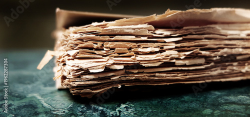 Old Tattered Worn Rough Paper Book or Packet of Documents Textured and Stained