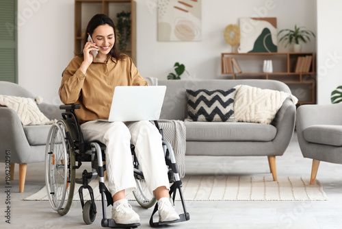 Young woman in wheelchair w...