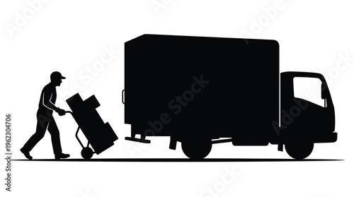 Man pushing boxes with a moving truck a striking black silhouette