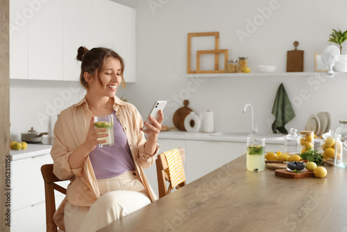 Young woman with tasty lemo...