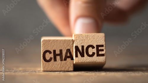 Hand touching a Scrabble letter block with the word 'change' on it.