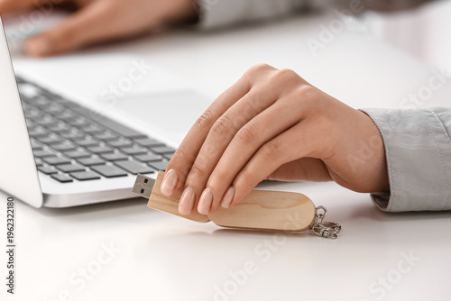 Woman with modern laptop an...
