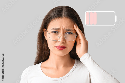 Young Asian woman suffering...