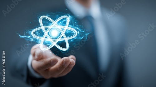 Businessman Holding Atom Symbol.
