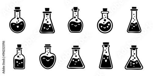 A collection of various laboratory flasks and beakers on a table indoors.