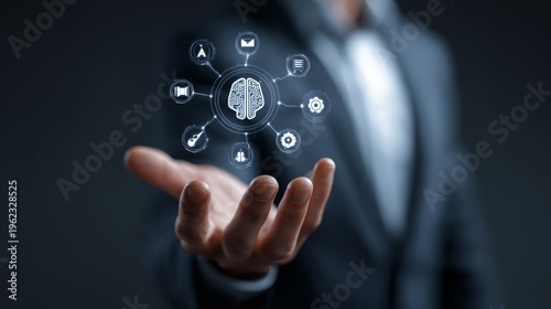 Businessman holding digital icons.