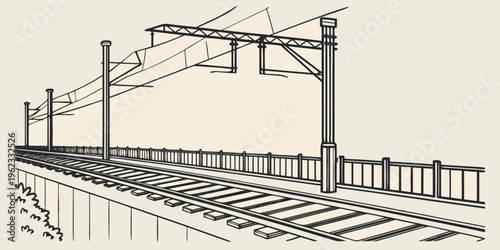 A train track with a fence and overhead wires