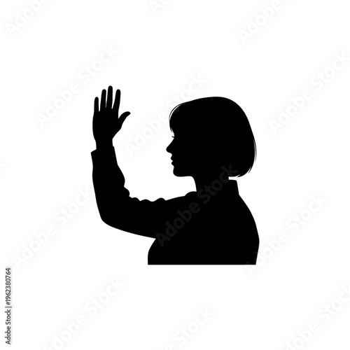 Silhouette of woman raising hand in profile.
