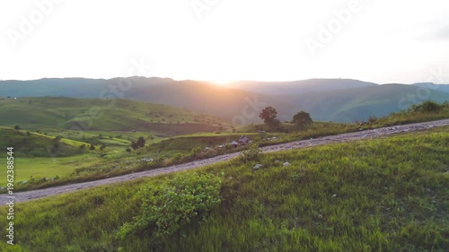 Golden Hour Aerial View of Rayta Hill Udaipur Sunset over Lush Green Mountains in Rajasthan