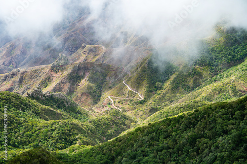 Anaga Tenerife Spain misty mountain landscape winding road in clouds uncertainty journey concept Canary Islands