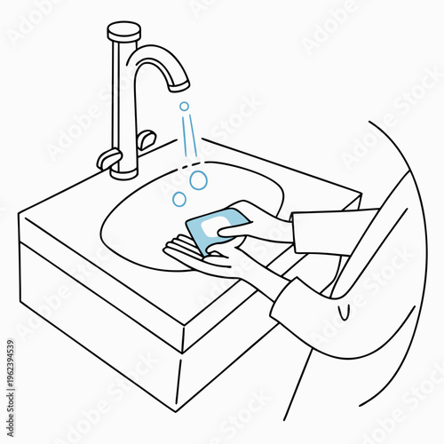 A person washing their hands with soap and water at a sink with a faucet
