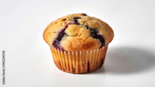 A delicious blueberry muffin in a paper wrapper on a white background
