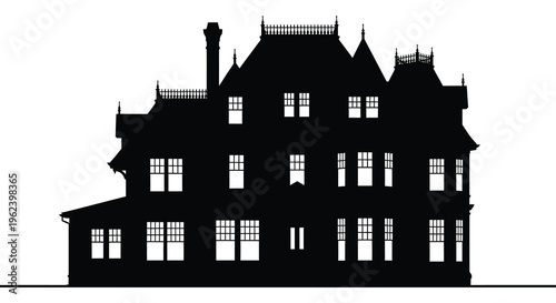 Silhouette of a large gothic style mansion house with many windows and turrets silhouette