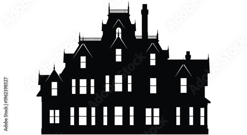 Silhouette of a large gothic style mansion with multiple turrets and chimneys