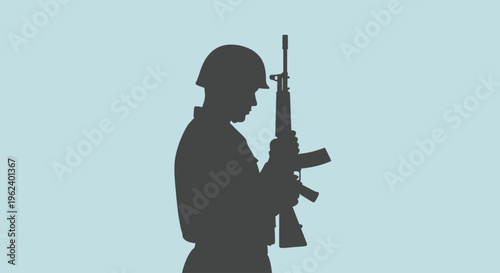 Soldier holds rifle in profile view with helmet on head standing still