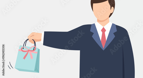 Man in suit holding gift bag with red ribbon in office setting
