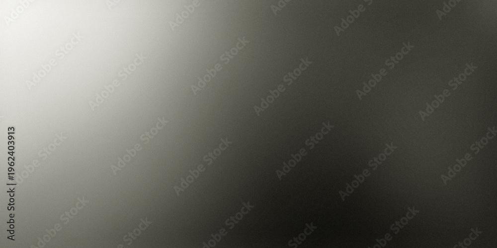 Naklejka premium A close-up view of a textured gray surface illuminated by a bright light source