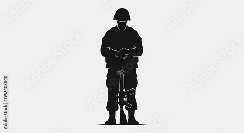 A soldier stands guard with his rifle in a neutral location.