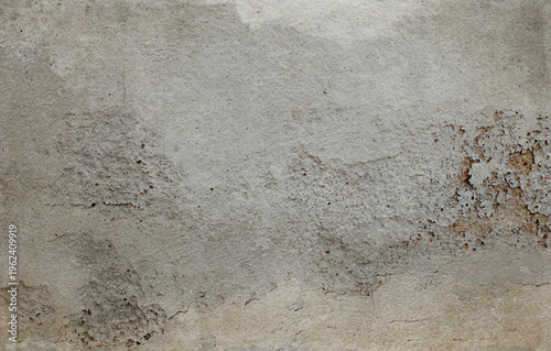 Abstract concrete wall with peeling plaster.