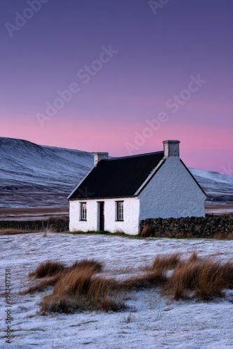 Cozy white cottage shines under a twilight sky