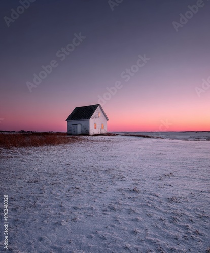 Brightly lit white house against a twilight sky