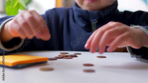 Young Boy Counting and Sorting Coins on Table  — Child Financial Literacy, Early Numeracy, Pocket Money and Money Management Concept
