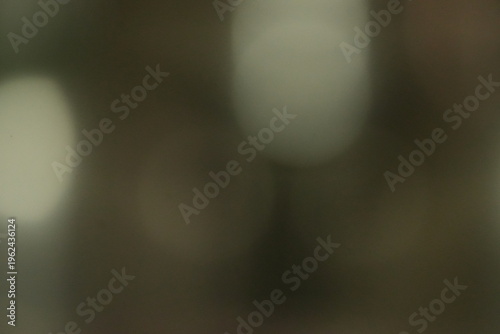 Dark Warm Bokeh Background with Soft Golden Light Highlights