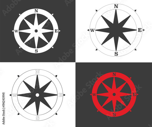 Four different colored compass rose navigation symbols